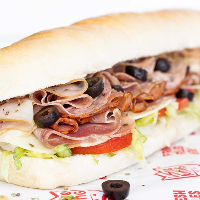 Since 1969 Little King sandwiches has been serving subs like this Italian meat combo sub topped with olives as Nebraska's favorite local restaurant franchise